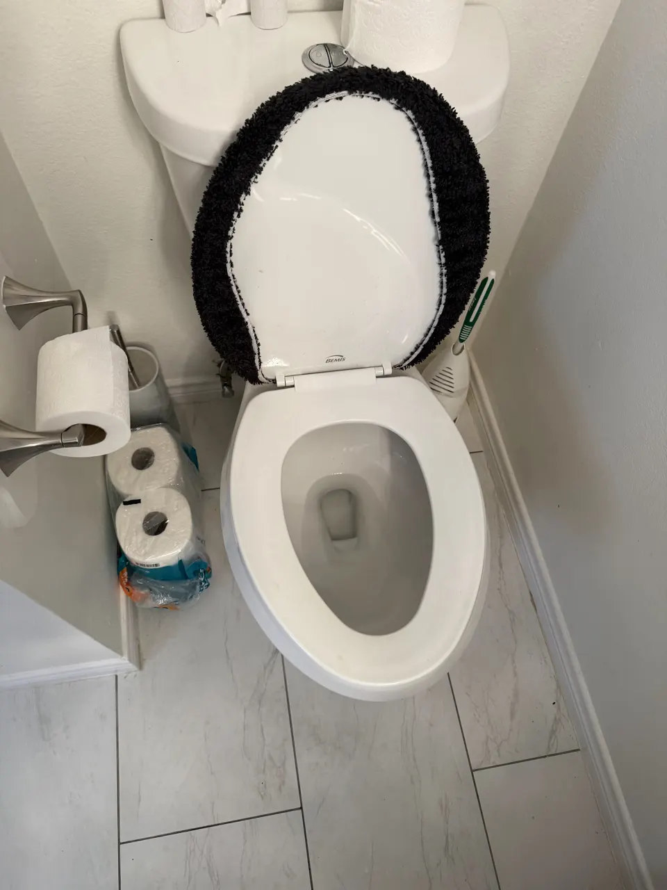 Freshly cleaned bathroom toilet and tile floor